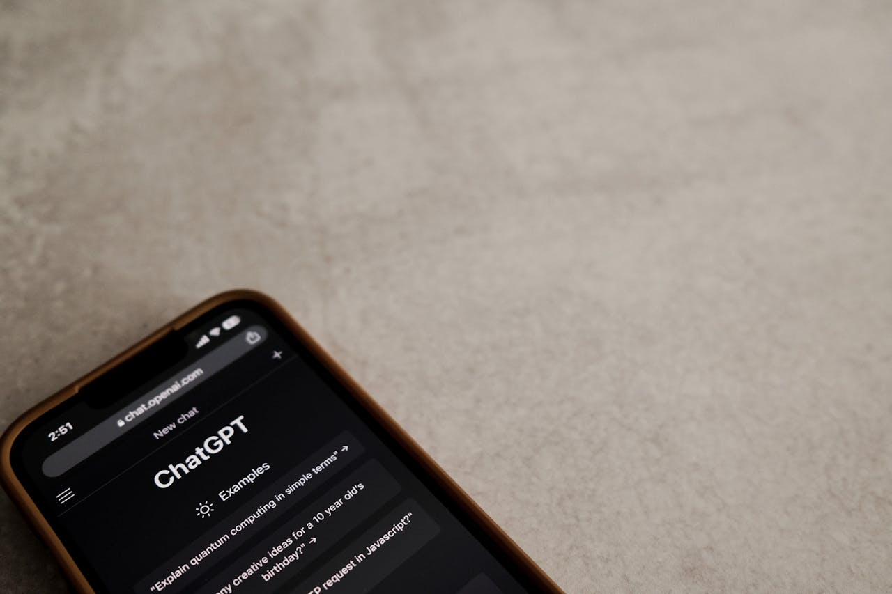 hero-img-02 A smartphone displays the ChatGPT interface on its screen, symbolizing modern AI technology.