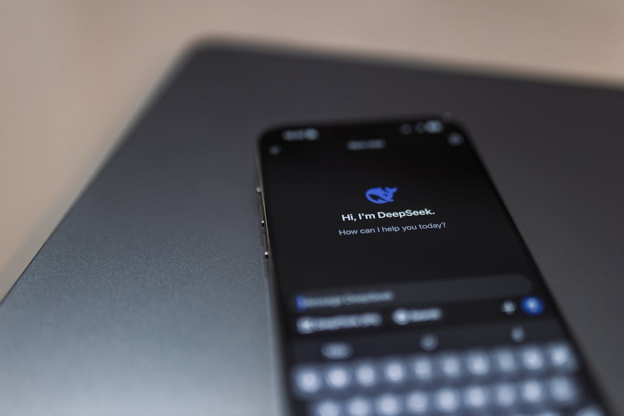 about-01 Close-up of a smartphone displaying an AI chat interface with the DeepSeek app.